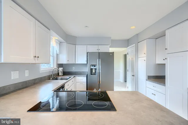a view of a kitchen with wooden floor