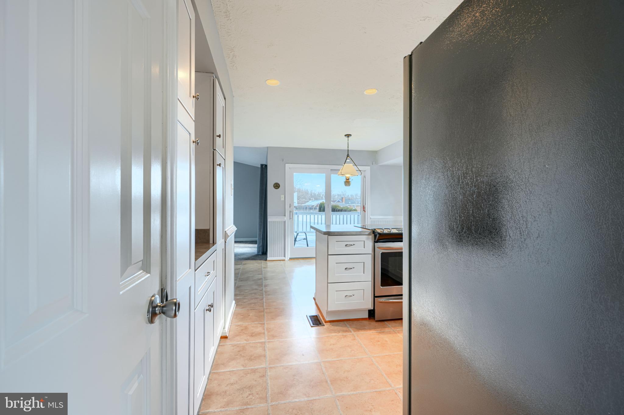 9213 Ramblebrook Road Nottingham, MD 21236 - Photo 16 of 51 Bright and inviting kitchen with outdoor access.