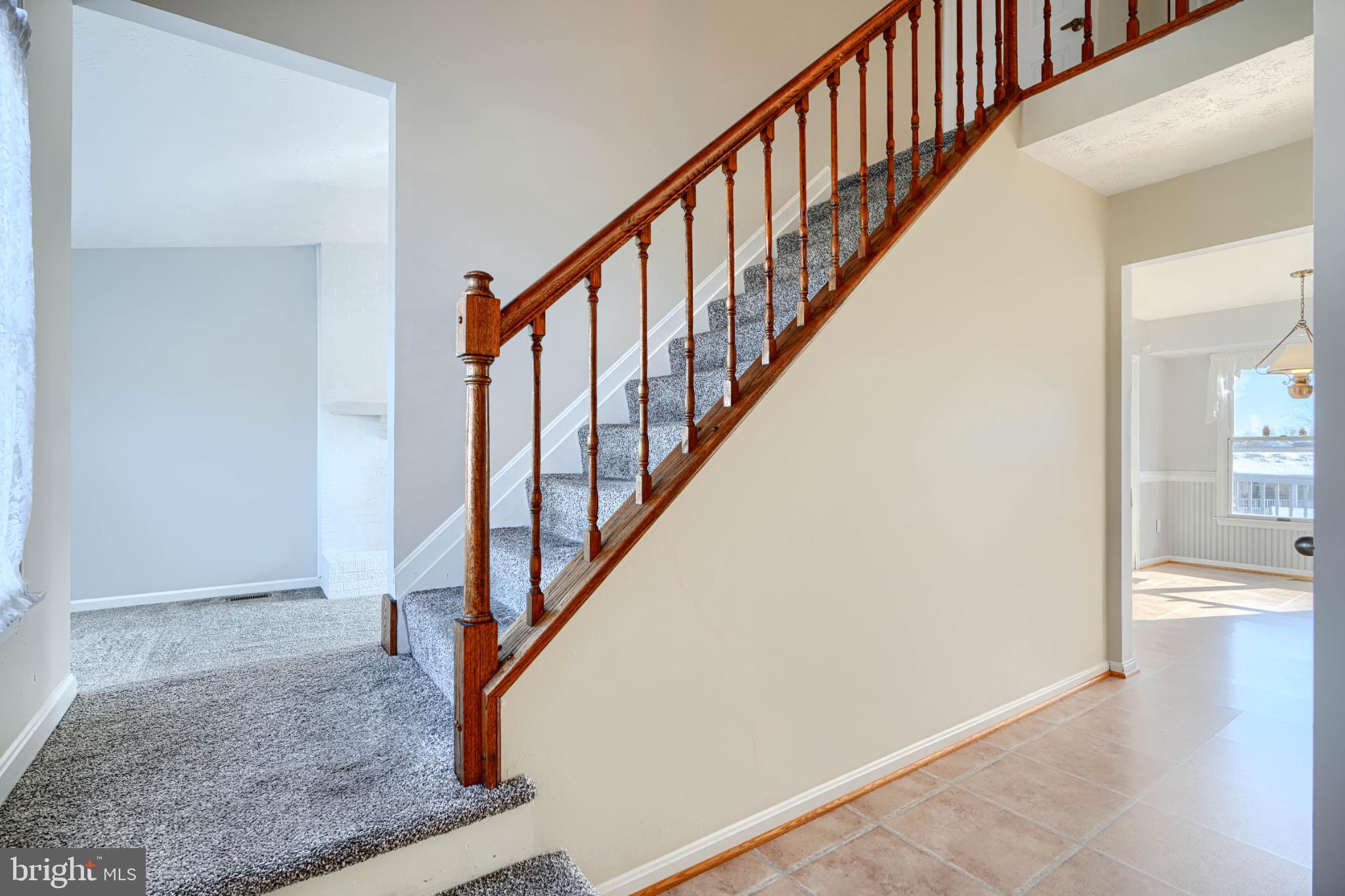 9213 Ramblebrook Road Nottingham, MD 21236 - Photo 23 of 51 Inviting entryway with elegant staircase.