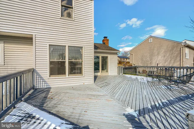 a view of a backyard with a large tree