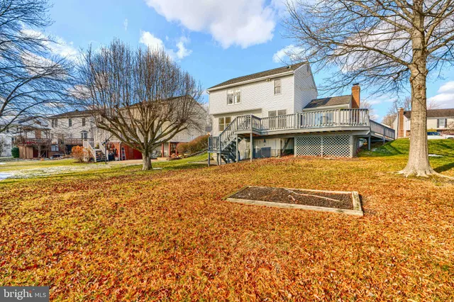 a view of a yard with snow on the road