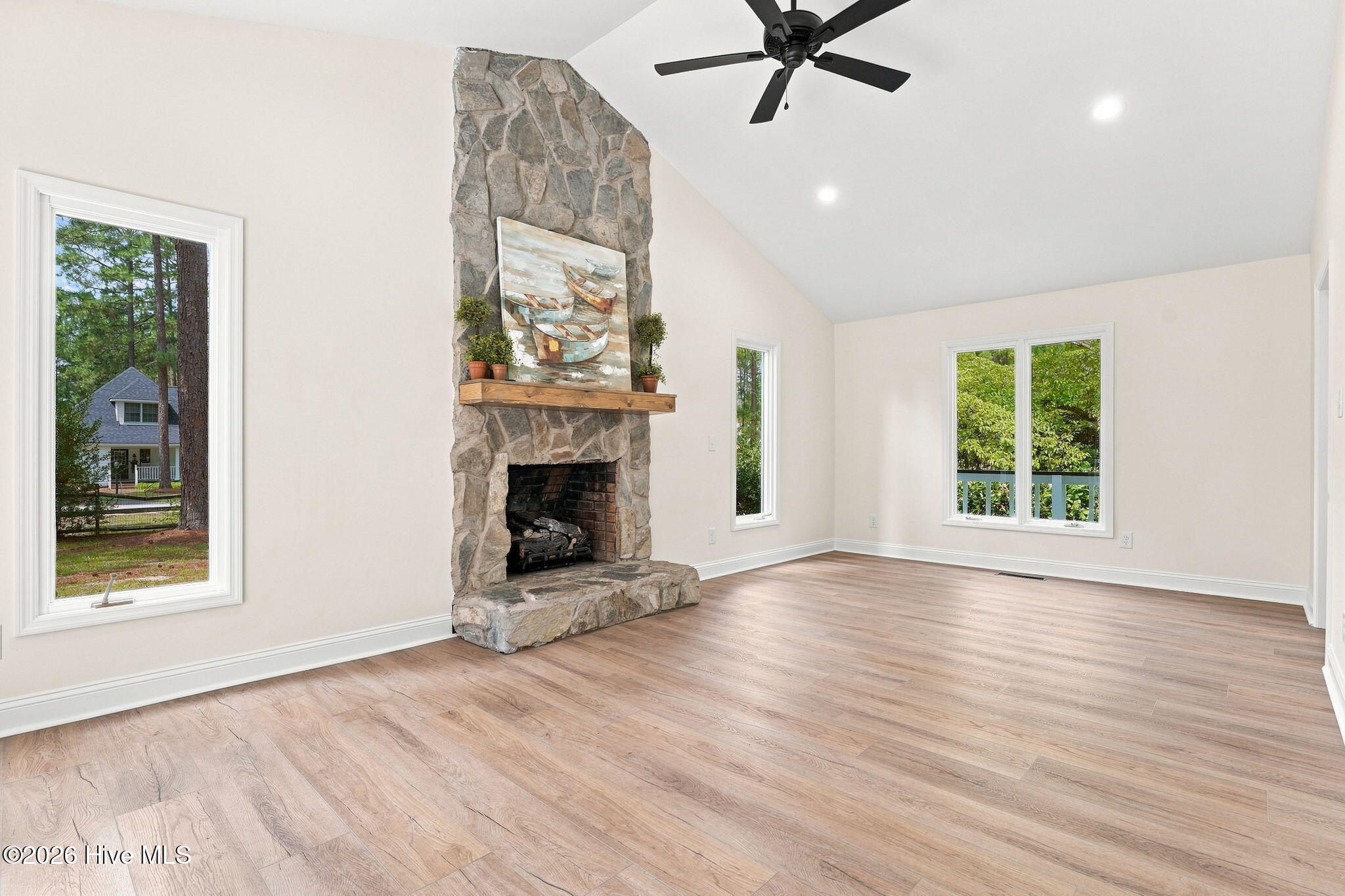 611 Sun Road Aberdeen, NC 28315 - Photo 14 of 59 Vaulted ceilings in the living room w/new fan & recessed light