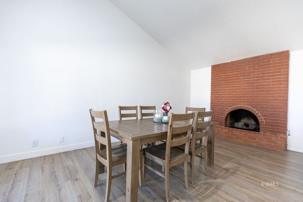 538 North Rio Bravo Street Ridgecrest, CA 93555 - Photo 18 of 45 a view of a dining room with furniture and wooden floor