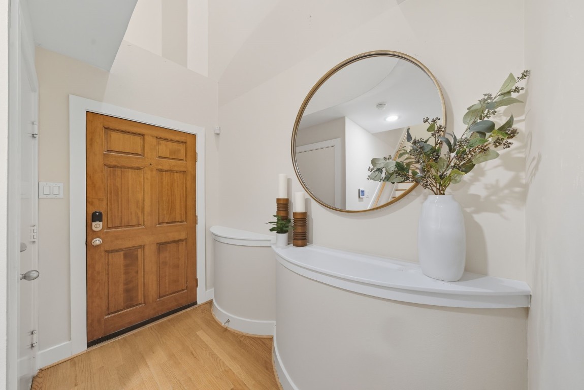 5817 Darling Street, Unit D Houston, TX 77007 - Photo 12 of 40 a bathroom with a sink a mirror and a shower