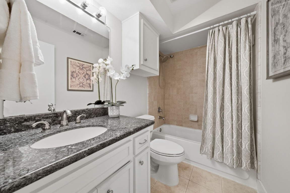 5817 Darling Street, Unit D Houston, TX 77007 - Photo 15 of 40 a bathroom with a granite countertop sink toilet and shower