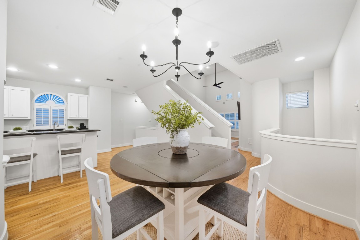 5817 Darling Street, Unit D Houston, TX 77007 - Photo 4 of 40 a view of a dining room with furniture and wooden floor