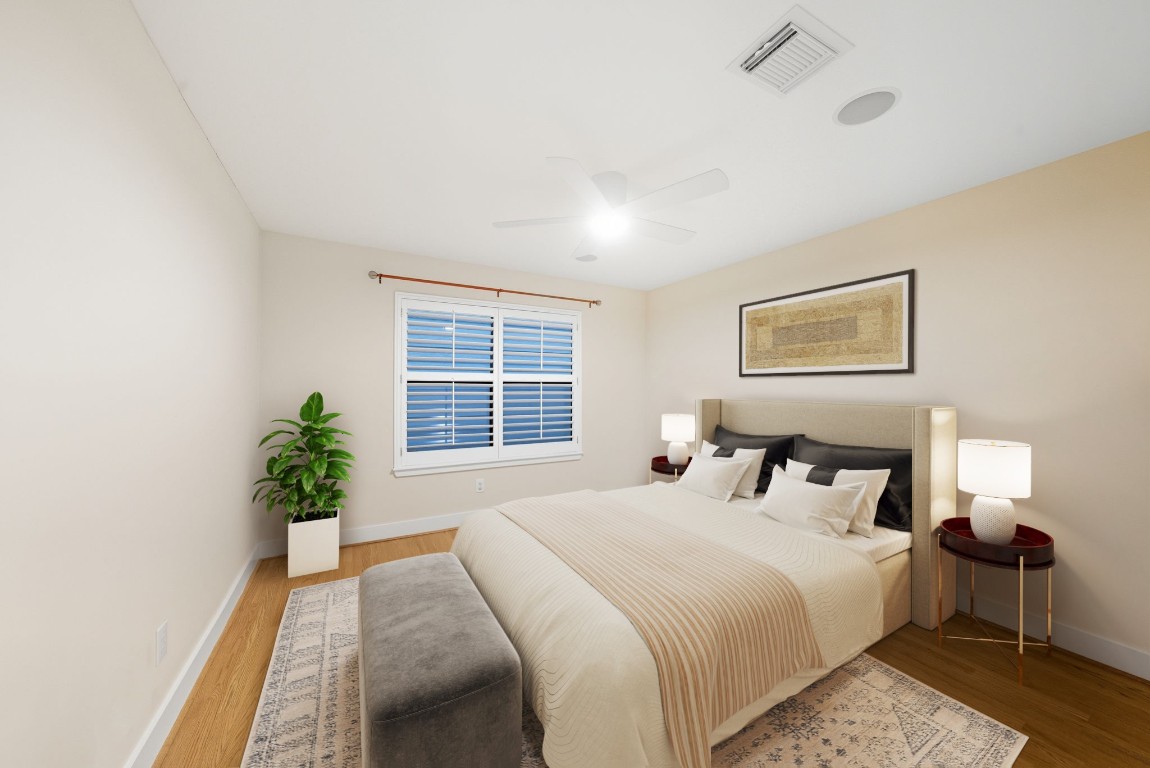 5817 Darling Street, Unit D Houston, TX 77007 - Photo 7 of 40 a bedroom with a bed and a potted plant