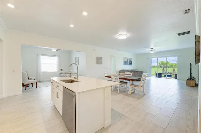 a bathroom with a bathtub a shower and a window