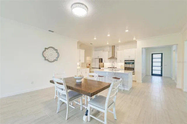 an empty room with a window and a ceiling fan