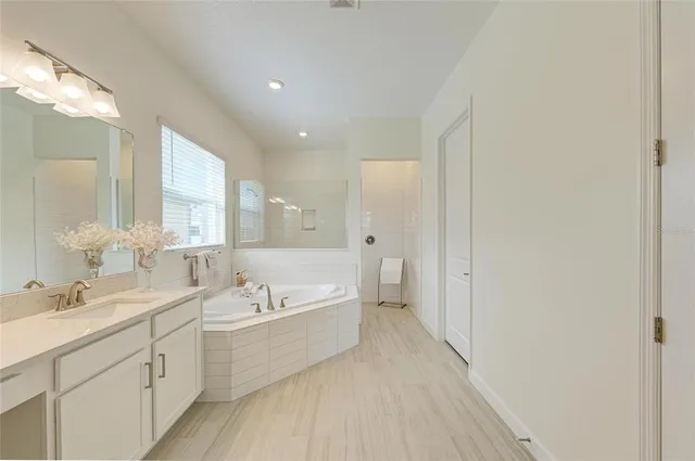 a view of a deck with a table chairs and garden