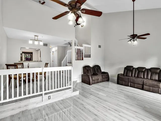 a bedroom with furniture and wooden floor