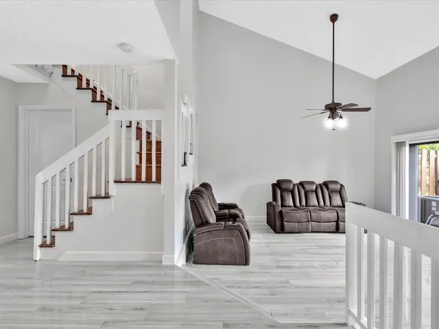a view of an entryway with wooden floor