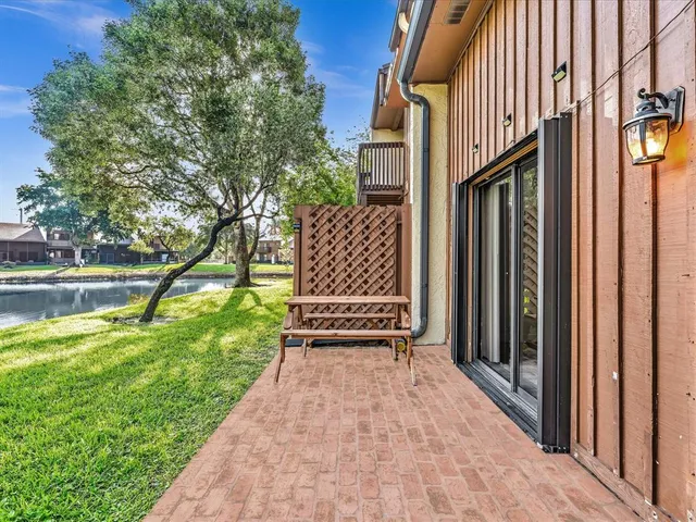 a view of lake with a house in the background