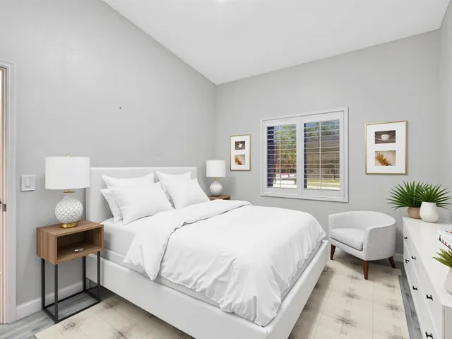 a view of a room with wooden floor and window