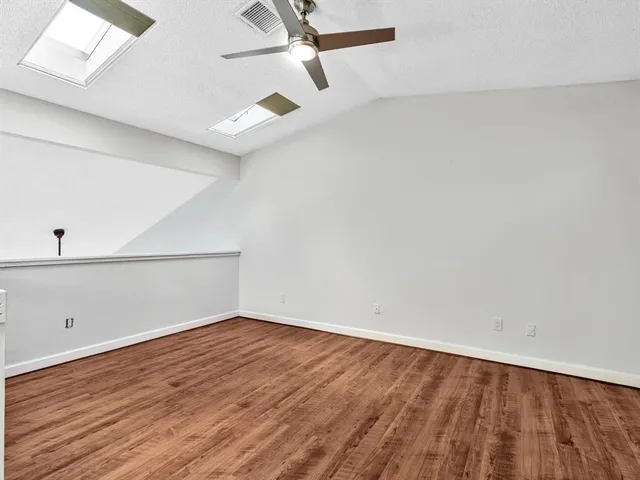 a bathroom with a toilet and shower