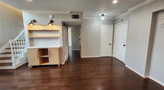 wooden floor in an empty room with a fireplace