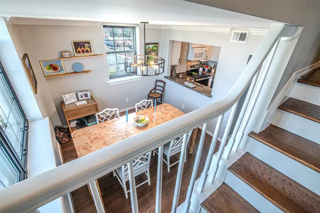 a view of an entryway with wooden floor