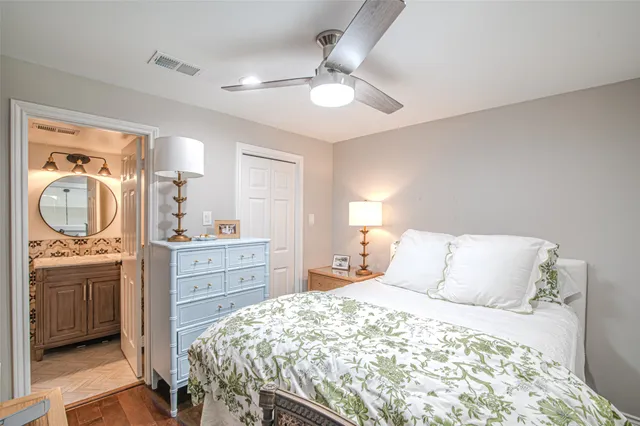 a bedroom with a bed and a dresser