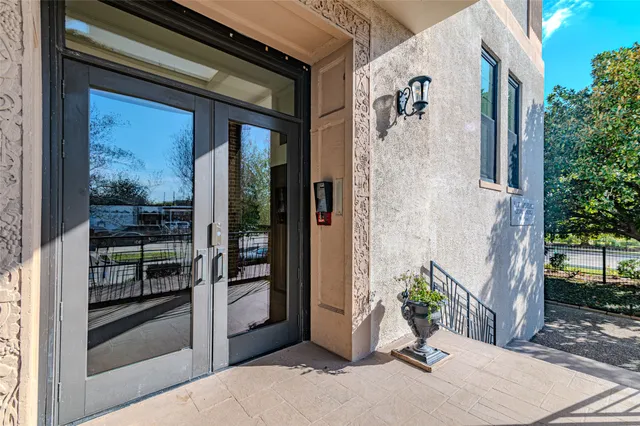 a view of potted plant in front of a door