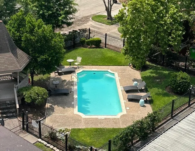 a view of a backyard with sitting area