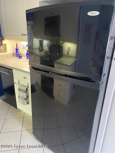 926 Jamestown Avenue, Unit 93 Indian Harbour Beach, FL 32937 - Photo 11 of 31 a kitchen with a sink cabinets and utility room