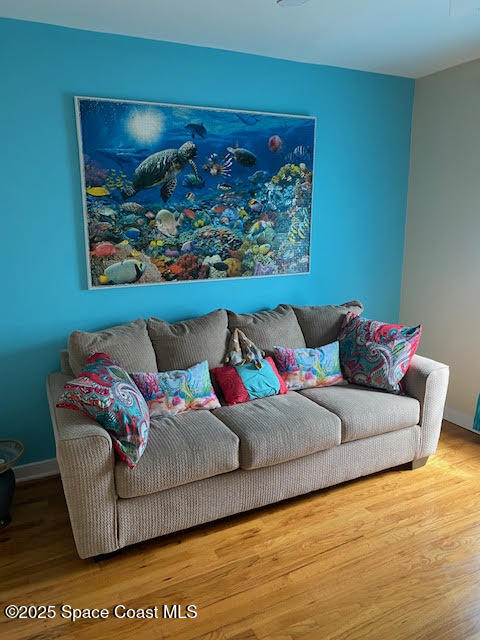 926 Jamestown Avenue, Unit 93 Indian Harbour Beach, FL 32937 - Photo 19 of 31 a living room with furniture and painting on the wall