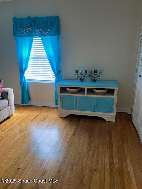 926 Jamestown Avenue, Unit 93 Indian Harbour Beach, FL 32937 - Photo 20 of 31 a room with wooden floor and window