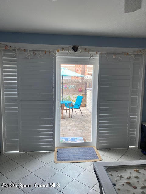 926 Jamestown Avenue, Unit 93 Indian Harbour Beach, FL 32937 - Photo 21 of 31 a view of a hallway with wooden floor and a glass door