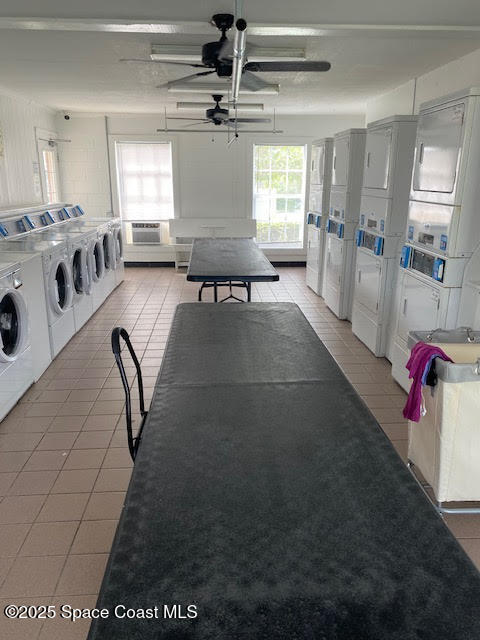 926 Jamestown Avenue, Unit 93 Indian Harbour Beach, FL 32937 - Photo 29 of 31 a living room with furniture and a chandelier