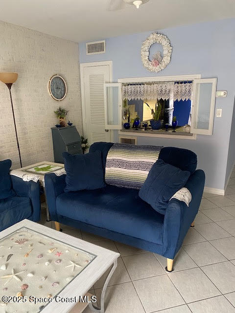 926 Jamestown Avenue, Unit 93 Indian Harbour Beach, FL 32937 - Photo 3 of 31 a living room with furniture and wooden floor