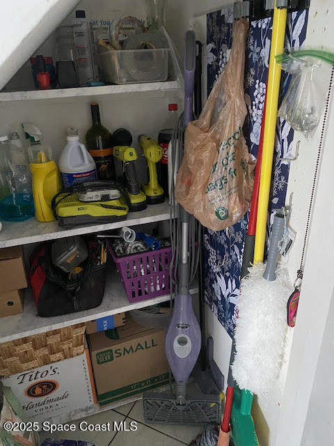 926 Jamestown Avenue, Unit 93 Indian Harbour Beach, FL 32937 - Photo 6 of 31 a store room with lots of different colored cloths