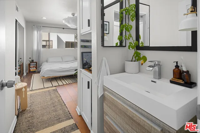 a bathroom with a sink and a mirror