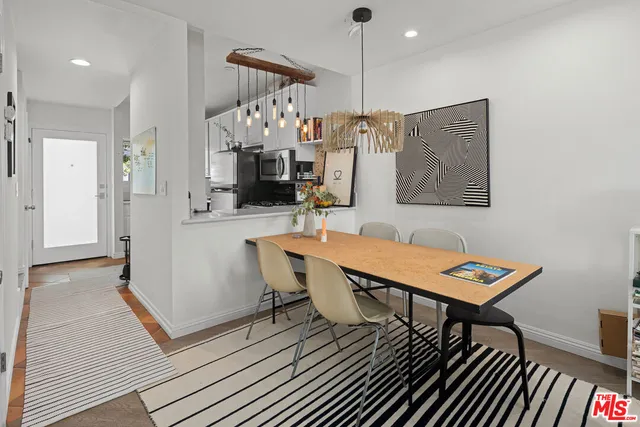a living room with furniture a rug and a chandelier