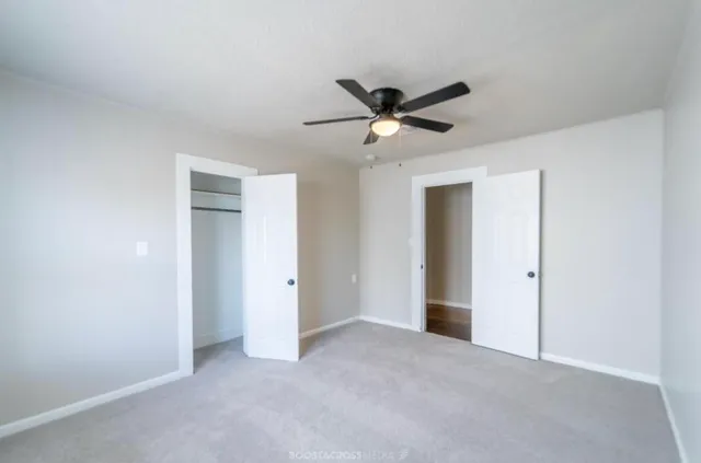 a view of a big room with closet and wooden floor