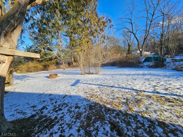 a view of yard with wooden fence