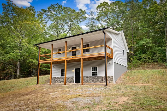 a view of a back yard of the house