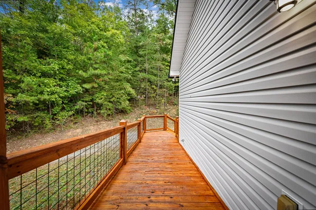 a large kitchen with stainless steel appliances granite countertop a sink and dishwasher a stove with wooden floor