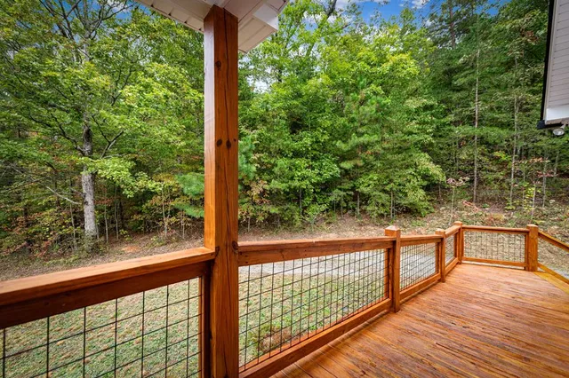 a large kitchen with stainless steel appliances granite countertop a sink and cabinets