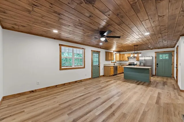 a view of room with wooden floor