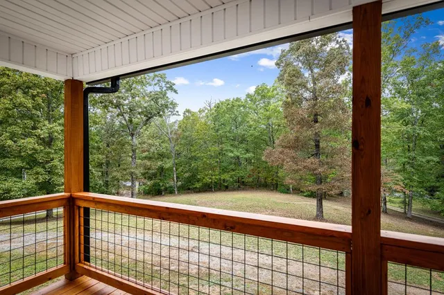 a view of an empty room with a white house