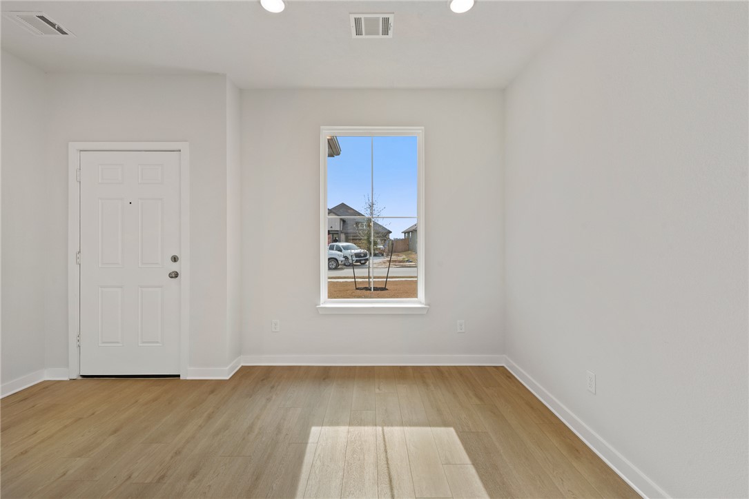 2412 Rooke Road Bryan, TX 77807 - Photo 8 of 35 a view of a room with wooden floor and window
