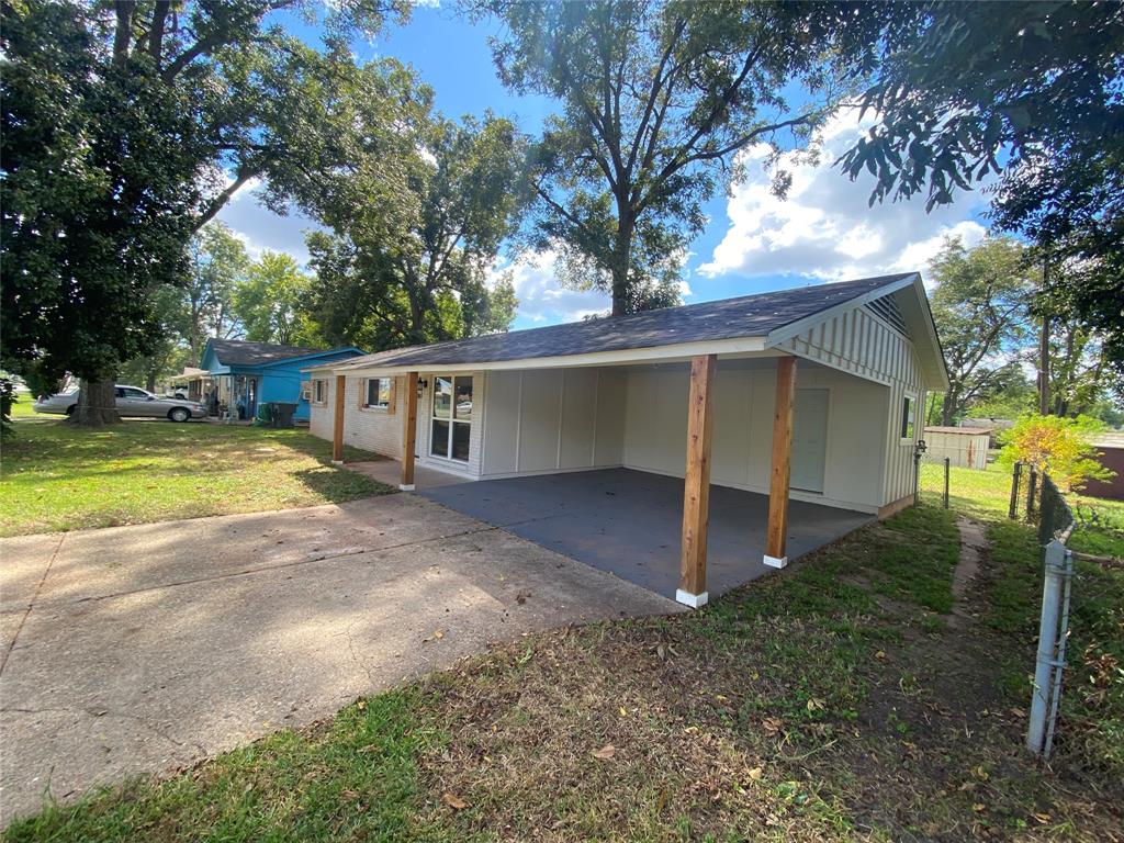 1609 Northgate Road Bossier City, LA 71112 - Photo 2 of 17 a view of a house with backyard and trees