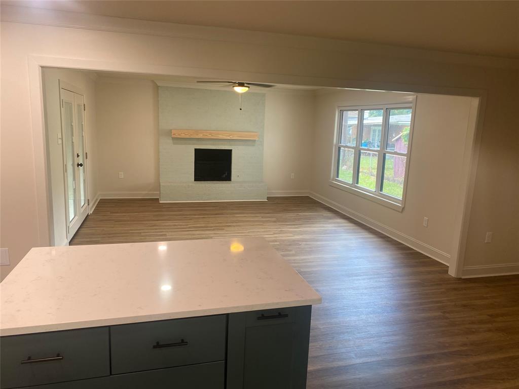 1609 Northgate Road Bossier City, LA 71112 - Photo 17 of 17 an empty room with wooden floor and windows