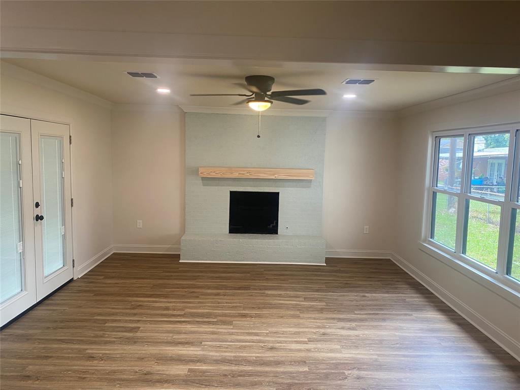 1609 Northgate Road Bossier City, LA 71112 - Photo 6 of 17 wooden floor in an empty room with a window