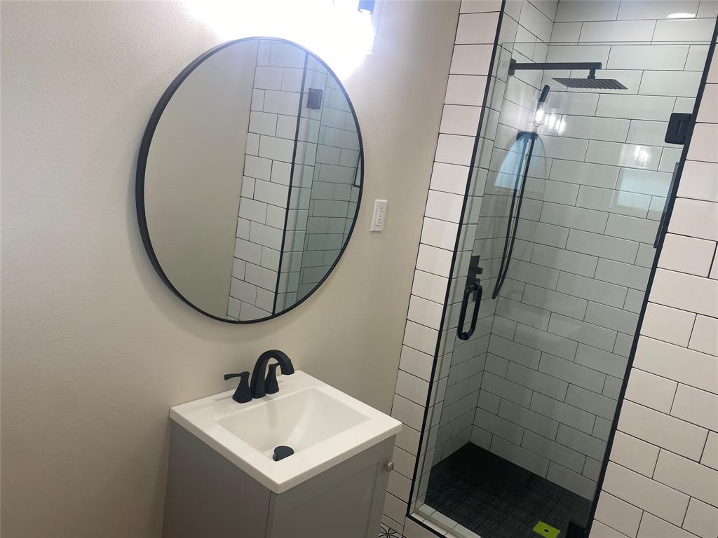 1609 Northgate Road Bossier City, LA 71112 - Photo 7 of 17 a bathroom with a sink and a mirror