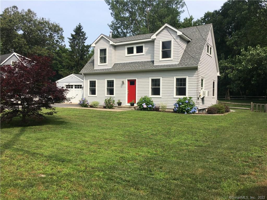 1088 Old Clinton Road Westbrook, CT 06498 - Photo 1 of 1 Front of home with new front door and newly paved driveway