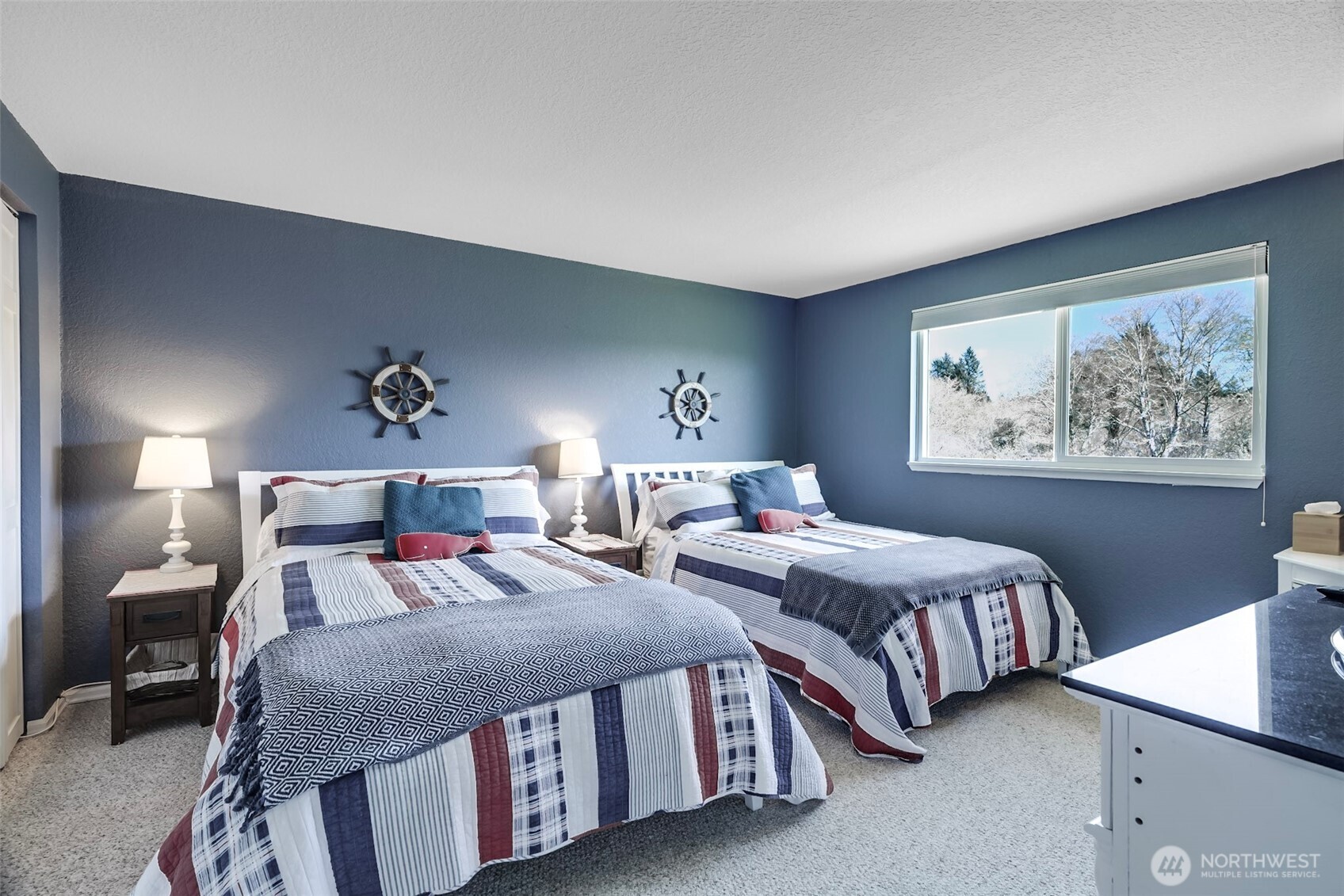 1420 48th Street, Unit B10 Seaview, WA 98644 - Photo 13 of 20 a bedroom with two beds and a night stand