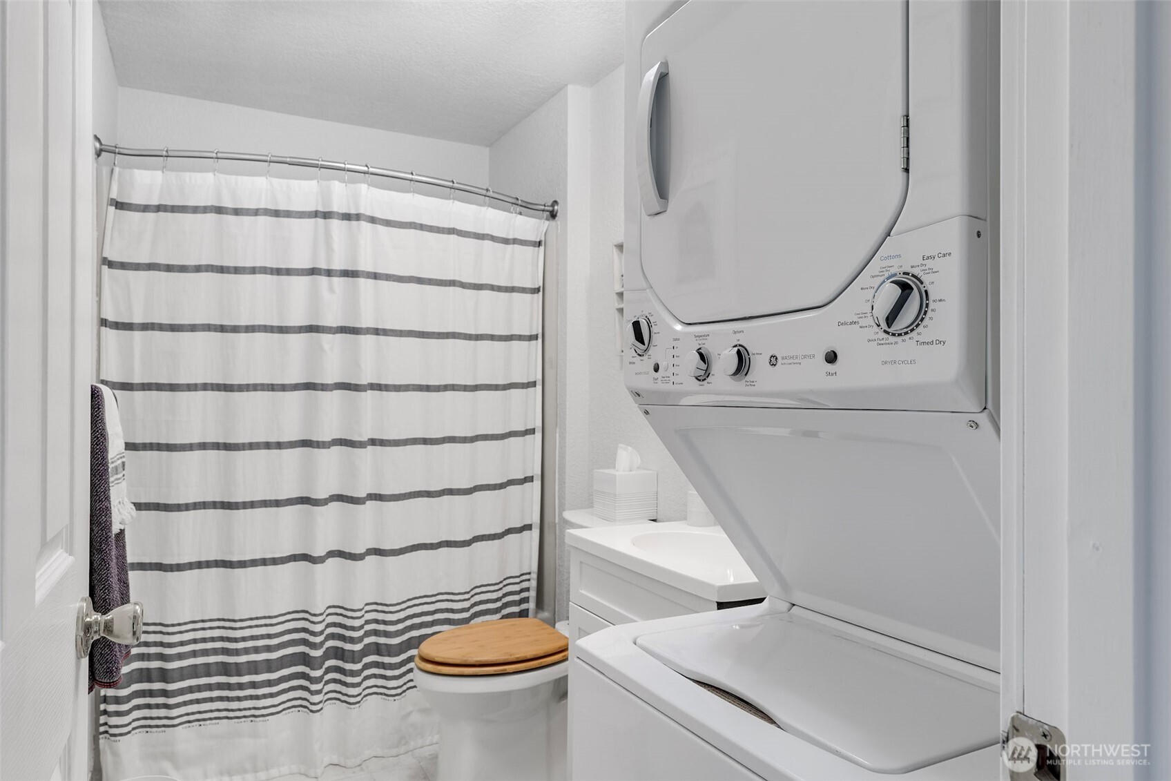 1420 48th Street, Unit B10 Seaview, WA 98644 - Photo 16 of 20 a bathroom with a sink toilet and shower