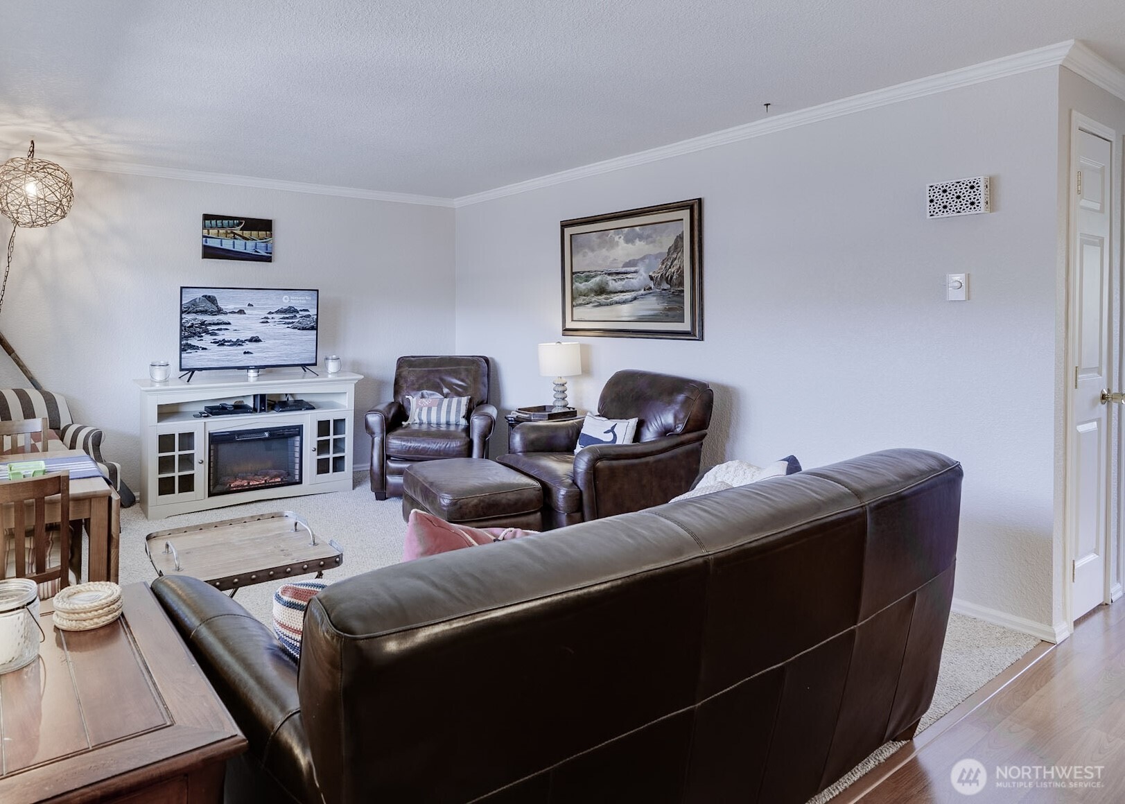 1420 48th Street, Unit B10 Seaview, WA 98644 - Photo 2 of 20 a living room with furniture and a flat screen tv