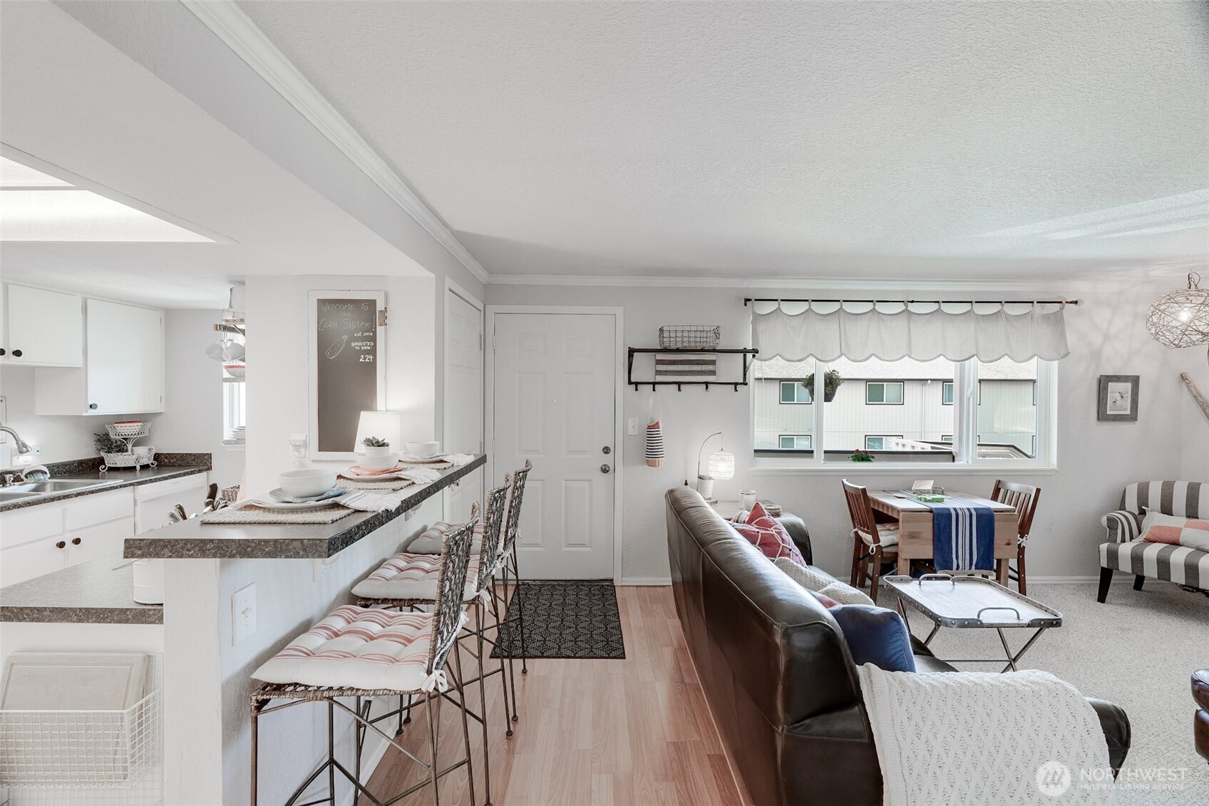1420 48th Street, Unit B10 Seaview, WA 98644 - Photo 5 of 20 a living room with stainless steel appliances kitchen island granite countertop furniture and a kitchen view